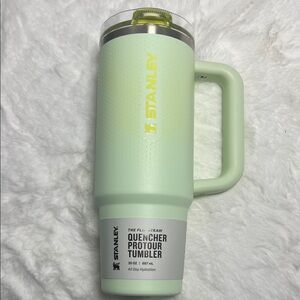 Stanley Mint Green Quencher Tumbler with Yellow Logo and Lid Flip